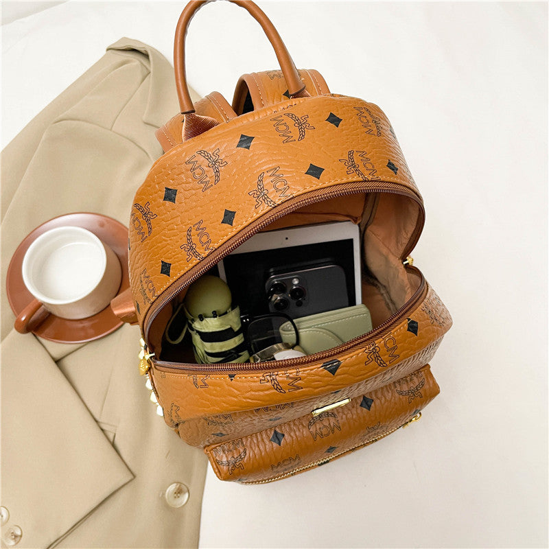 High - end genuine leather texture women's bag, large - capacity soft leatherbag Wide shoulder straps and matte leather backpacks create a retro and relaxed look